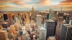 Sunset aerial view of New York City looking over midtown Manhattan towards downtown.