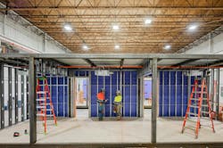 The structural steel frame of the modular chassis for this permanent modular building is designed to allow for shipping, picking and setting while maintaining structural integrity comparable to traditionally constructed steel frame buildings.