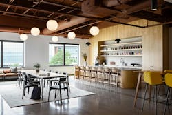 MGP Ingredients Offices, Leawood, Kan. The lobby leads to the 10,000-sf office&rsquo;s highlight, a hospitality area anchored by a bar that features MGP Ingredients&rsquo; liquor brands. This flexible area is used day-to-day for employee meals and as a space for special client events and gatherings