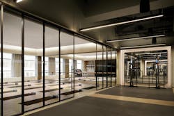 Savoy Club, New York, N.Y. Telescoping glass and mirrored walls filter daylight into fitness areas