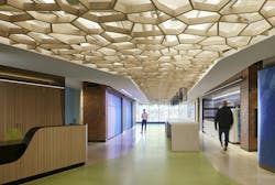 Confidential Technology Client Headquarters, Chicago, Ill. The west-facing Boulevard pre-function anchors the space, highlighting the fluid architecture and bespoke ceiling reminiscent of tree cover and natural materials Confidential Technology Client Headquarters, Chicago, Ill. The west-facing Boulevard pre-function anchors the space, highlighting the fluid architecture and bespoke ceiling reminiscent of tree cover and natural materials