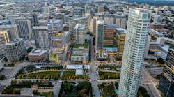 Pictured: Bank of America Tower at Parkside, Dallas, Texas. The Bank of America Tower at Parkside&rsquo;s 30 stories feature a striking sculptural design, where transparent glass and landscaped terraces blend seamlessly with the park below, creating a visually dynamic experience