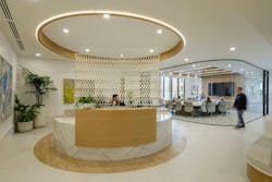 Davis Wright Tremaine, Portland, Ore. The main lobby entrance to DWT creates a welcoming, calming environment for those arriving, with abundant daylight, lush plants, curated art, and a distinctive circular quartz reception desk