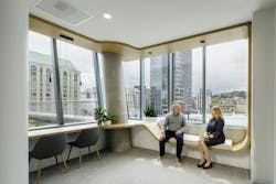 Davis Wright Tremaine, Portland, Ore. Continuous curved wood casework creates both seating and workstations.