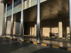 Concrete filled stainless steel finished tubular columns in an entrance of an Big shopping mall construction exterior finishes for an lucrative finishes