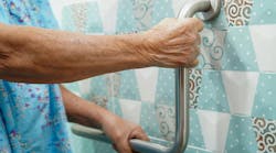 elderly old woman patient use toilet support rail in bathroom, handrail safety grab bar, security in nursing hospital