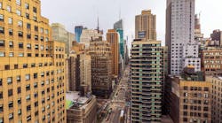 Beautiful landscape view of New York City skyline with high-rise buildings and busy street seen from above. New York. USA.
