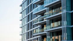Outside view of modern apartments with glass terraces