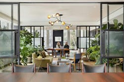 Two people sitting in modern biophilic office room Two people sitting in modern biophilic office room