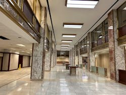 Walter P Moore transformed the historic 1911 Whitney Bank building in New Orleans into multifamily residences, adding amenities like a fitness center, rooftop pool, terrace, and dog park while preserving its iconic architecture. Photo &copy; Walter P Moore