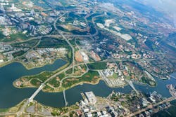 Overhead city view of Putrajaya. Aerial cityscape, Malaysia. Overhead city view of Putrajaya - Putra lake, Seri Saujana Bridge, Prime Minister`s Department Complex, Federal Government Administrative Centre, Putra Mosque.