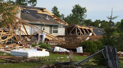 Tornado Storm Damage House Home Destroyed by Wind. Tornado wind and storm wreaks severe damage onto a residential family home. The structure is damaged beyond repair and will need to be rebuilt. Roof gapes open and the dwelling is knocked off its foundation. We can only hope the people living here had insurance for their house. Disaster relief was delivered quickly to the people in the neighborhood. High winds from a hurricane cause similar devastation.