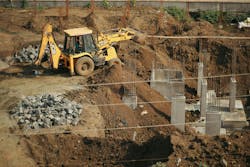 Yellow and Black Heavy Equipment on Brown Sand