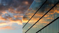Modern Office Building. Modern glass office building with sunset reflection
